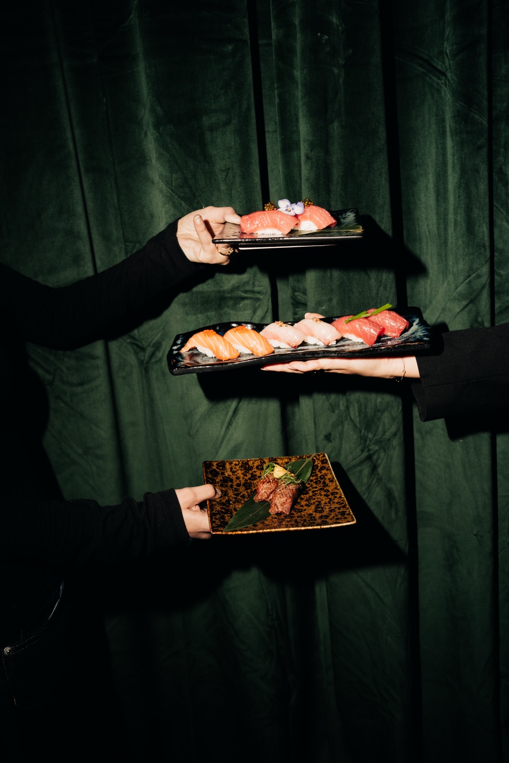 Hand-folded gyoza on a slate plate